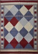 A Kilim with all over diamond design within a cube and banded border. L.239xW.179cm