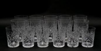 A collection of sixteen glass tumblers with stylized foliate design. Various sizes. H.10.5cm