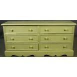 A Victorian style painted small chest of six short drawers on shaped bracket feet. H.65 W.133 D.41cm