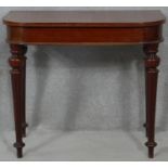 A 19th century mahogany console table fitted with frieze drawer on tapering fluted supports. H.72