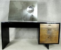 A mid century vintage lacquered dressing table with mirror inset with concave vanity glass and metal