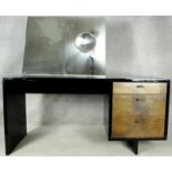 A mid century vintage lacquered dressing table with mirror inset with concave vanity glass and metal