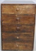 A vintage teak collectors chest of five drawers. H.48 W.33 D.38cm