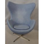 After Arne Jacobsen (1902-1971) Egg chair in pale blue upholstery and rise and fall action on four
