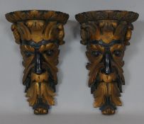 A pair of 19th century giltwood wall brackets carved with Green Man masks. H.25cm