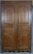 A 19th century carved chestnut French armoire. H.218 W.129 D.59cm (extensive woodworm damage and
