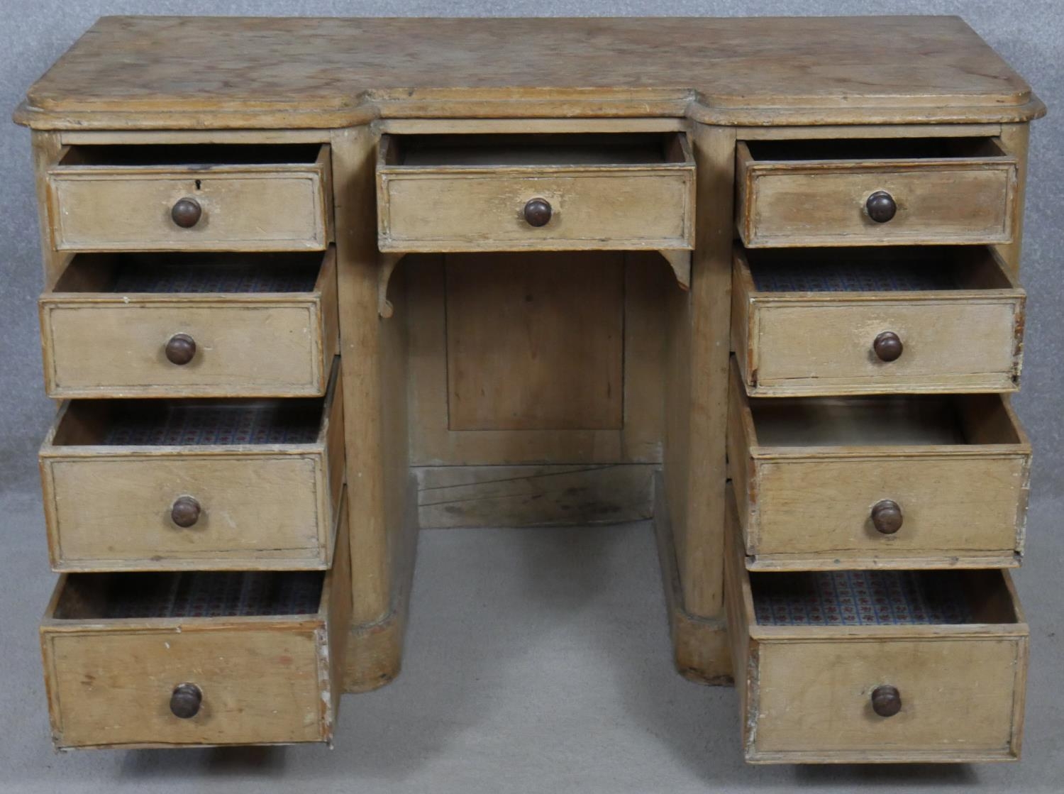 A Victorian pine kneehole desk with an arrangement of nine drawers on plinth base. H.76.5 W.120 D. - Image 2 of 9