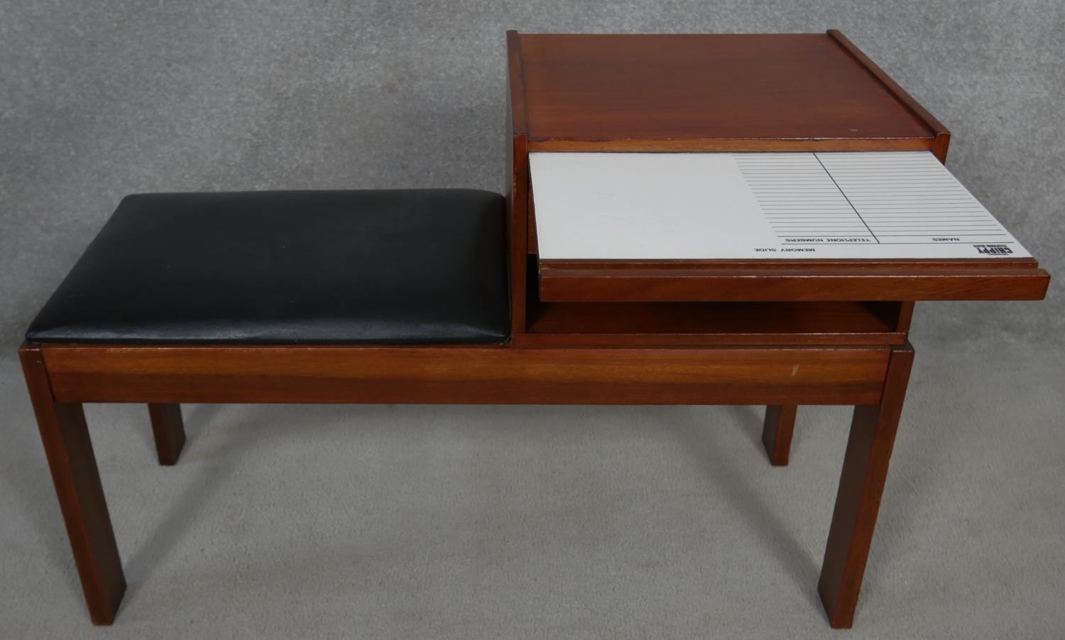 A 1970's vintage teak telephone table with pull out laminated directory board marked; Original - Image 3 of 7