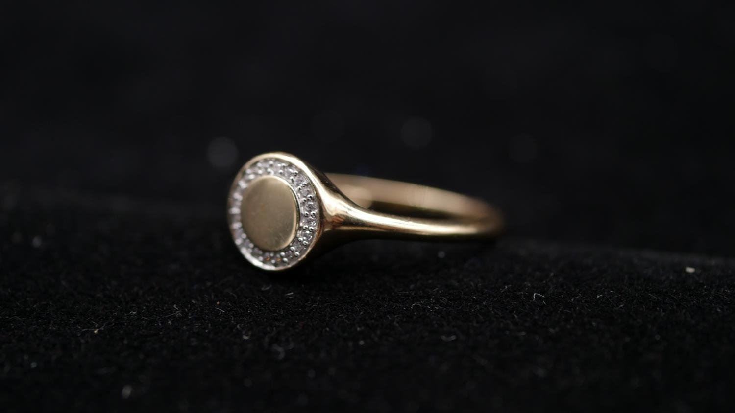 A cubic zirconia set 9 carat yellow gold signet ring. Set with twenty round brilliant cut cubic - Image 2 of 3