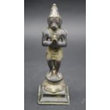 An early 20th century Indian bronze statue of the monkey god Hanuman with white metal clothes and