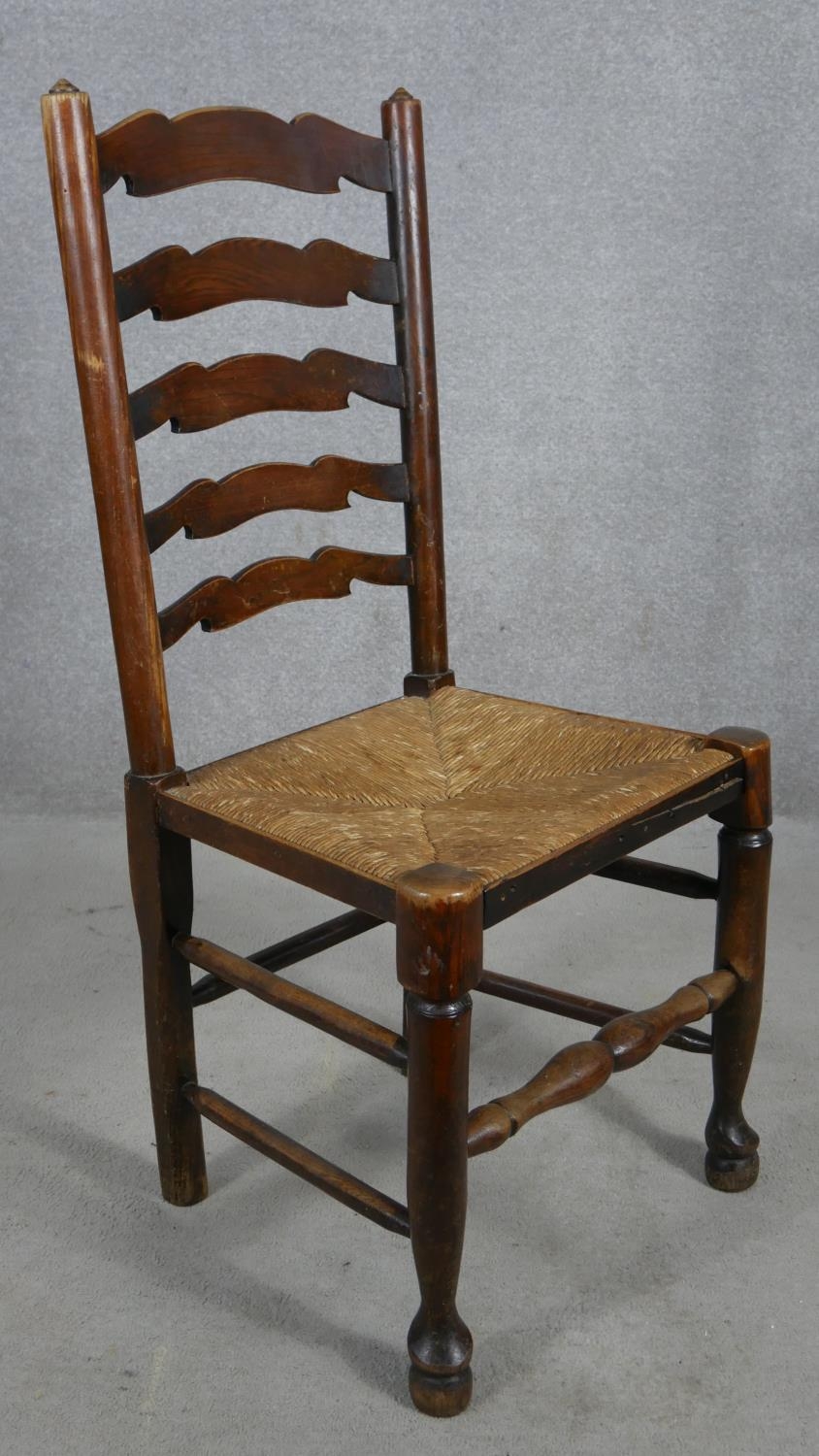 A set of six oak Lancashire ladderback dining chairs with woven rush seats on turned stretchered - Image 4 of 7