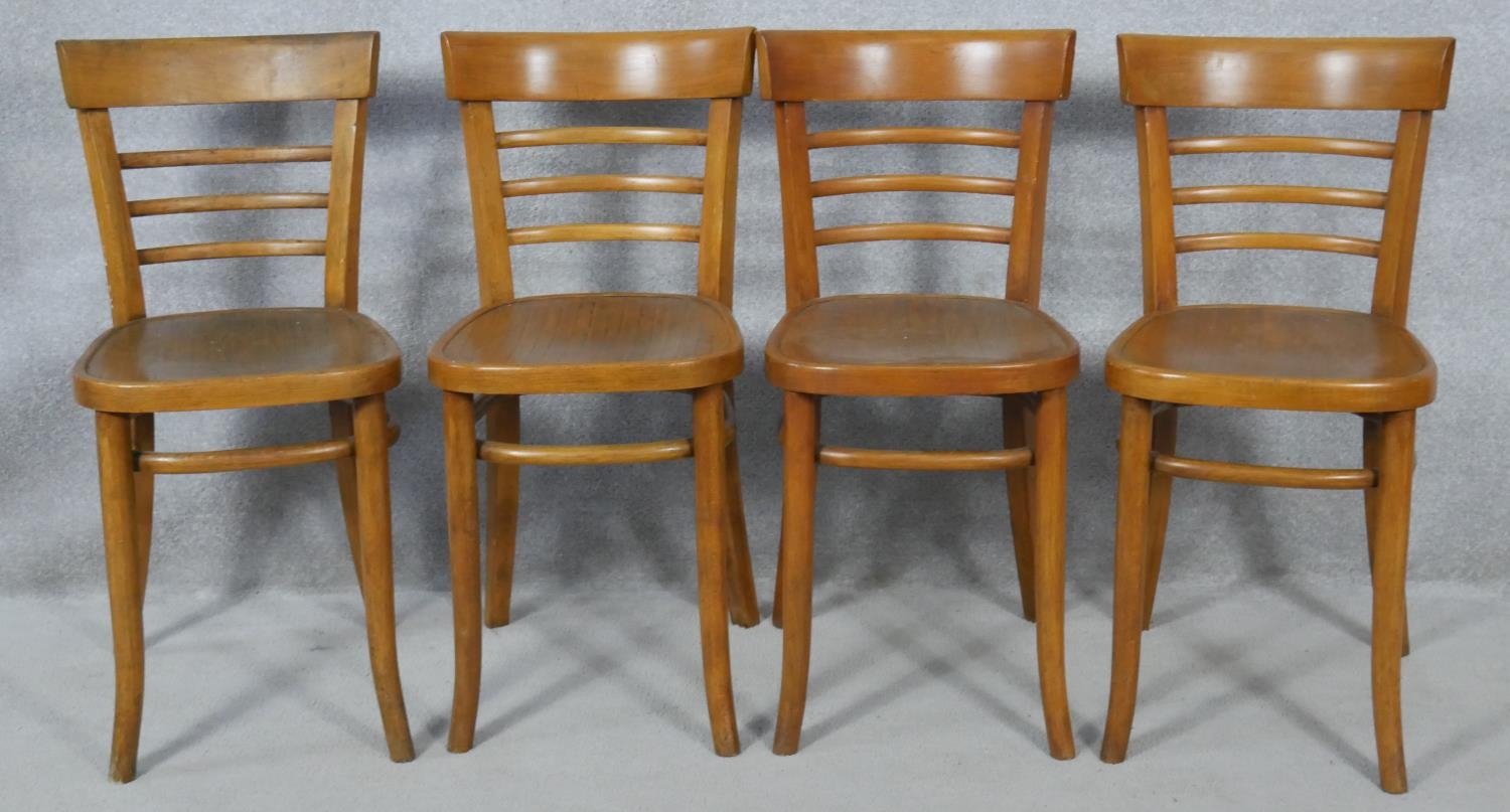 A set of four mid century beech bentwood cafe style chairs. H.78cm