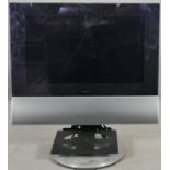 A Bang & Olufsen BeoCenter 6-26 TV. 26" screen on a swivel stand and with remote control. H.80cm