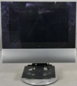 A Bang & Olufsen BeoCenter 6-26 TV. 26" screen on a swivel stand and with remote control. H.80cm