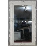 A full height mirror in white painted Rococo style frame. H.210 W.125cm