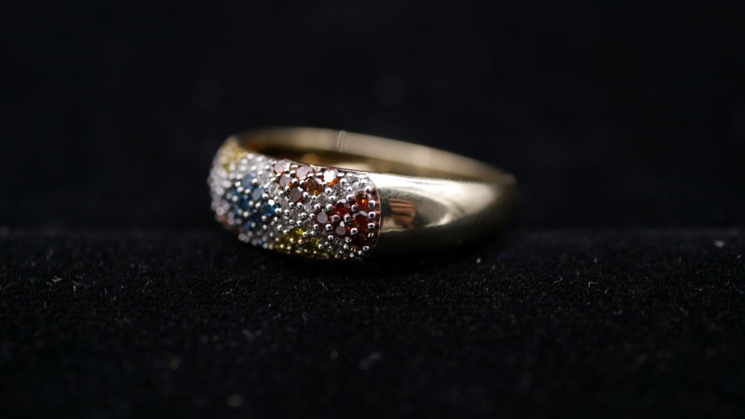 A 9 carat yellow gold and coloured diamond half eternity ring. Set to centre with nine round - Image 2 of 3