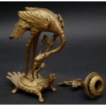 A Meiji period Japanese gilt bronze candle stick in the form of a Manchurian crane standing on a