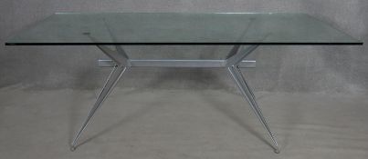 A 1980's plate glass topped dining table on metal base, T/38 by Studio Archirivolto for Fasem. H.