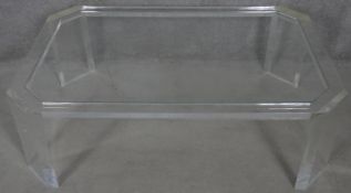 A late 20th century designer clear lucite coffee table. H.38.5 L.120 W.79cm