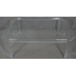 A late 20th century designer clear lucite coffee table. H.38.5 L.120 W.79cm