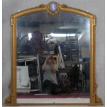 A late 19th century gilt overmantel mirror with Classical style Jasperware intaglio to the