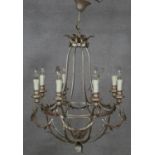 An eight branch ceiling chandelier with scrolling foliate metal frame. Dia.64cm