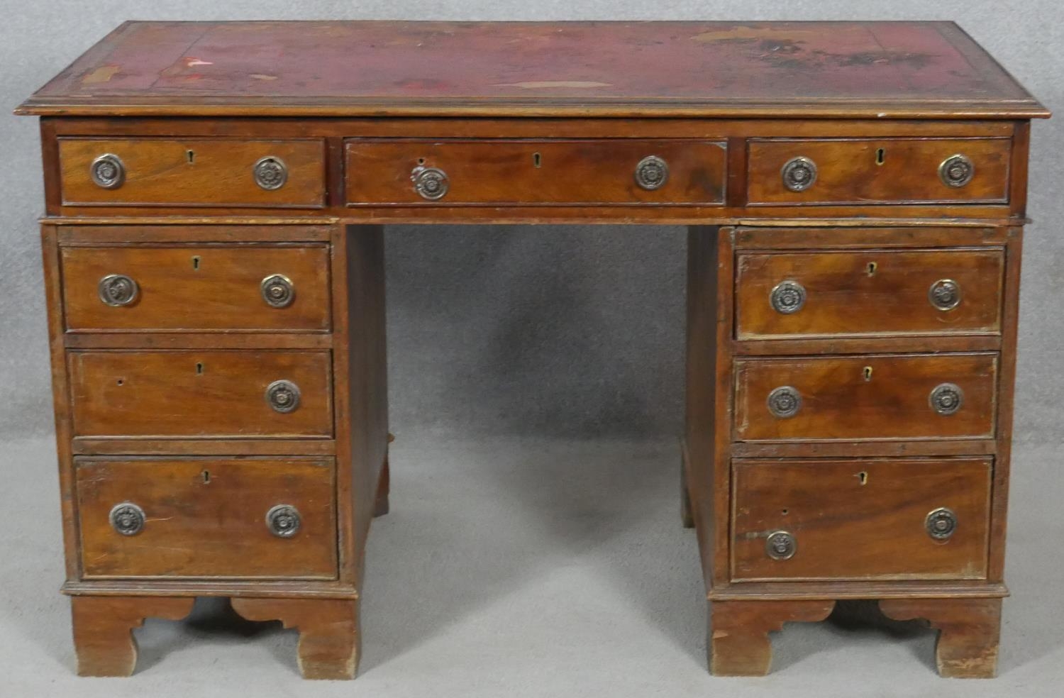 A 19th century mahogany three section pedestal desk with inset leather top resting on bracket