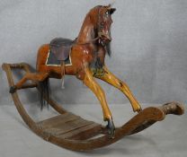 A C.1900 carved and painted rocking horse on bow rocker. H.104 L.190cm