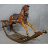 A C.1900 carved and painted rocking horse on bow rocker. H.104 L.190cm