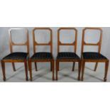 A set of four Continental Art Deco burr walnut and inlaid dining chairs with geometric cut