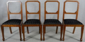 A set of four Continental Art Deco burr walnut and inlaid dining chairs with geometric cut