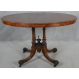 A Victorian burr walnut quarter veneered and satinwood inlaid occasional table on quatreform