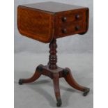 A Regency mahogany, satinwood crossbanded and ebony strung drop flap work table with frieze