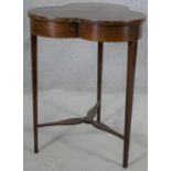 An Edwardian mahogany and satinwood inlaid occasional table with trefoil shaped top raised on square