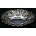 A Victorian sterling silver repousse pierced work dish with lattice work panels, floral and