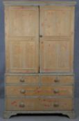 A 19th century pine press cupboard fitted with linen slides above two short and two long drawers