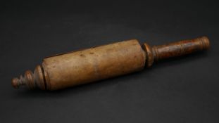 An antique Torah vellum Hebrew scroll on a turned boxwood spindle. L.30cm