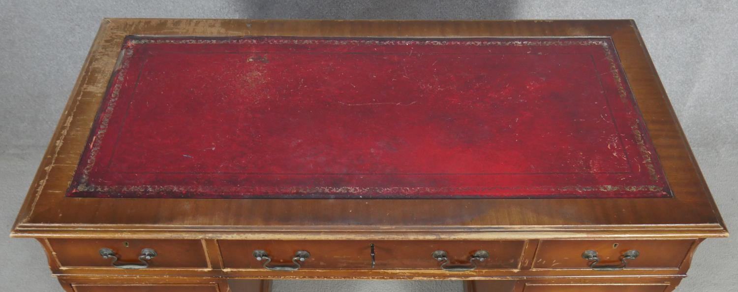 A Georgian style mahogany three section pedestal desk with inset leather top on shaped bracket feet. - Image 3 of 5