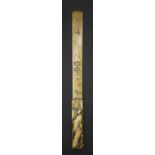 A Japanese Meiji period Shakudo mixed metal page turner, the blade engraved with a floral design.