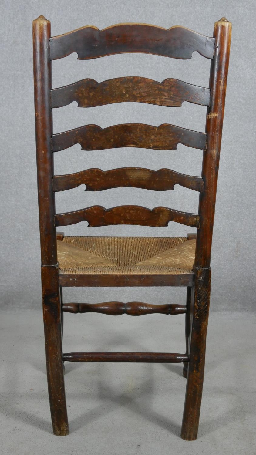 A set of six oak Lancashire ladderback dining chairs with woven rush seats on turned stretchered - Image 5 of 7