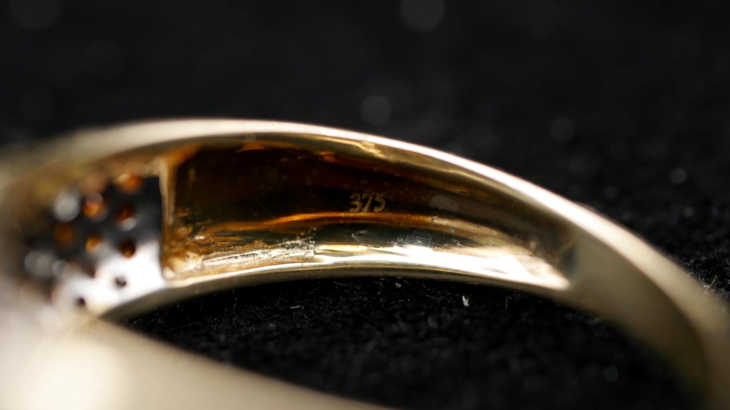 A 9 carat yellow gold and coloured diamond half eternity ring. Set to centre with nine round - Image 3 of 3