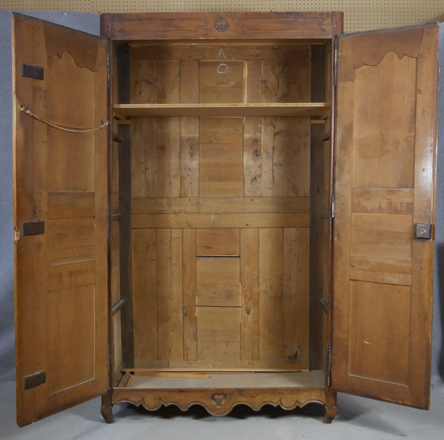 A 19th century carved chestnut French armoire. H.218 W.129 D.59cm (extensive woodworm damage and - Image 2 of 40