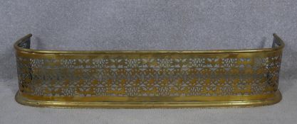 A 19th century brass fender with pierced foliate decoration. H.19 W.92 D.26cm