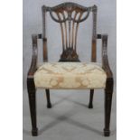 A C.1900 mahogany armchair with carved pierced splat and husk and swag decoration in floral