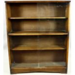 A vintage teak bookcase with sliding glass plate doors. H.113 W.91 D.24cm