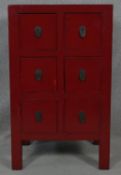 A miniature Chinese lacquered chest of six drawers on block supports. H.78.5 W.47 D.40cm