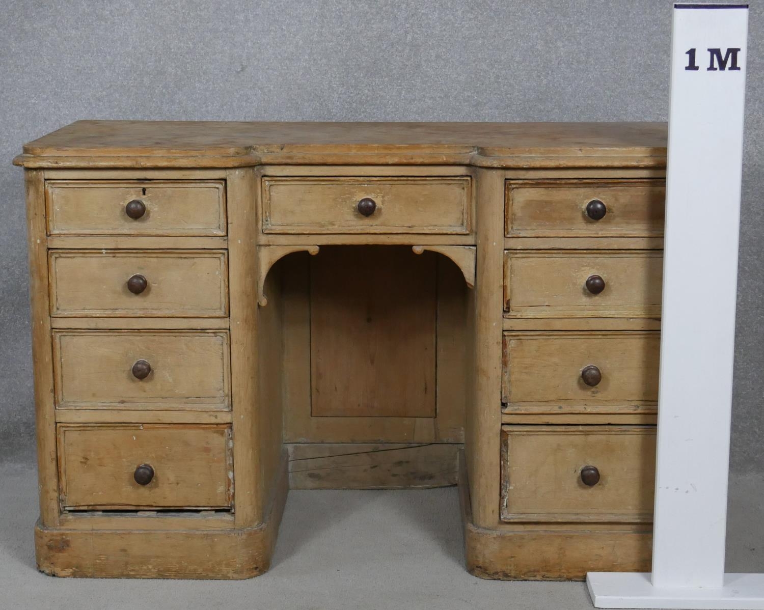 A Victorian pine kneehole desk with an arrangement of nine drawers on plinth base. H.76.5 W.120 D. - Image 9 of 9