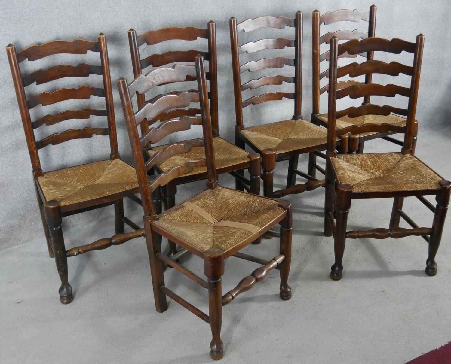 A set of six oak Lancashire ladderback dining chairs with woven rush seats on turned stretchered - Image 2 of 7