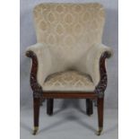 A Regency carved mahogany framed tub armchair in cut floral upholstery raised on square tapering
