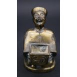 A Chinese brass figure of an official as an incense burner, in robe with hat and long plait,